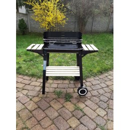 Garden charcoal grill with adjustable grate