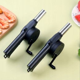 Handheld blower for lighting a grill fire