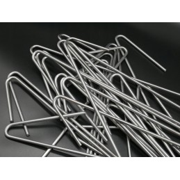 Inkariniai kaiščiai neaustiniam geotinkleliui